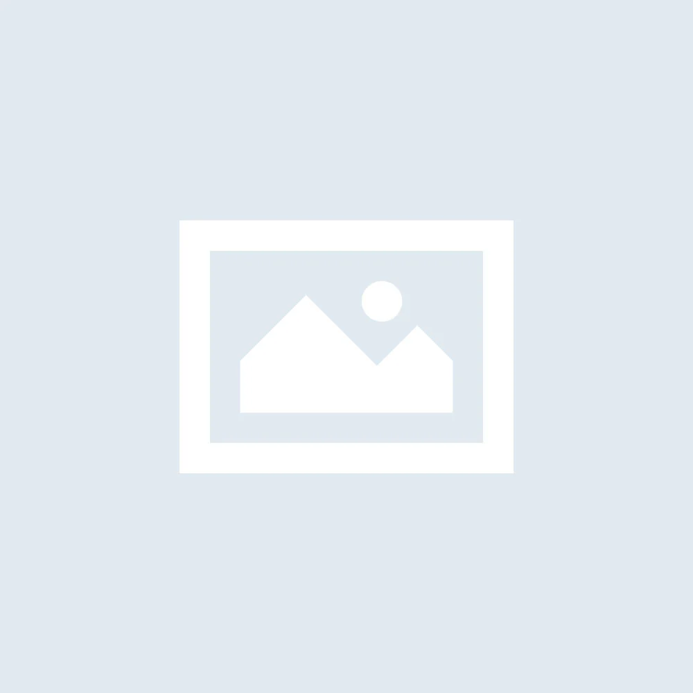 Student with fair skin taking the Modern Language Aptitude Test in a quiet classroom setting, focusing on audio headset and paper, realistic photography, natural lighting, 16:9 landscape.